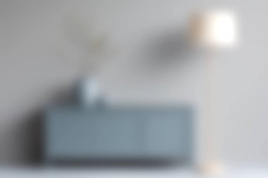 Mavi bir dolap ve parlak bir lambanın bulunduğu sakin bir oturma odası modern yaşam tarzı için mükemmel bir minimalist atmosfer yaratıyor..