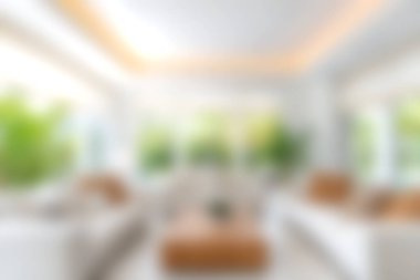 Modern dekorun ve büyük pencerelerden gelen doğal ışığın bol olduğu parlak ve havadar bir oturma odası. Samimi atmosfer kapalı bitkiler ve zarif mobilyalarla tamamlanıyor..