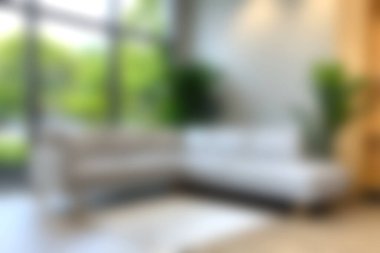 Bu resim doğal ışıkla dolu modern bir oturma odası yakalıyor. Zarif mobilyalar ve bereketli ev bitkileriyle, rahat ama sofistike bir ortam yaratıyor..