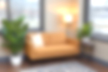 A warm and inviting living room featuring an orange couch, greenery, and soft lighting, perfect for relaxation and stylish home decor.