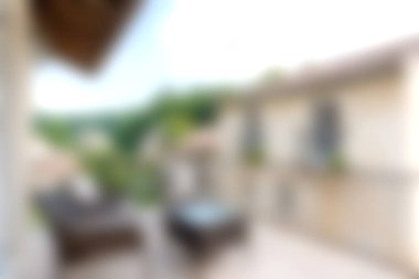 Inviting outdoor balcony featuring modern furniture, perfect for relaxation. Enjoy scenic views of lush greenery and experience tranquility in this cozy space.