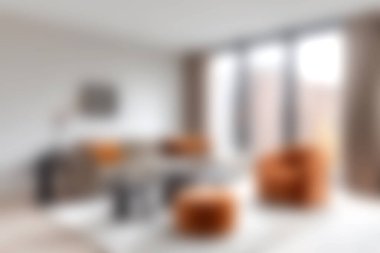 This image showcases a cozy modern living room featuring stylish furniture and vibrant orange accents, illuminated by natural light from large windows.