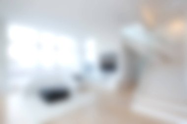 This image captures a modern and bright living space featuring an open layout filled with natural light. The elegant decor and furniture create a comfortable atmosphere.