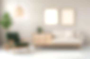 Bu resim, minimalist tasarımı olan modern bir oturma odasını gösteriyor. Konforlu mobilyalar, doğal elementler ve rahatlamak için mükemmel bir atmosfer içeriyor..