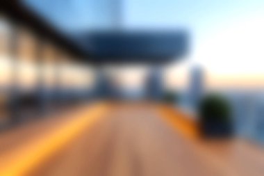 Çarpıcı bir manzara günbatımında modern bir şehir terasını yakalıyor, canlı şehir silueti üzerinde sıcak bir ışık ve sakin bir ortam sergiliyor..