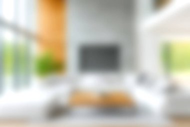 Geniş pencerelerden geçen doğal ışıkla dolu şık ve modern bir oturma odası, minimalist dekorlar ve rahat bir atmosfer, rahatlama ve aile toplantıları için mükemmel..