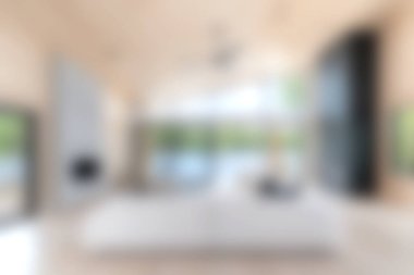 Bu resim, modern dekor, büyük pencereler ve sükunet ve rahatlığı davet eden minimalist bir estetiğe sahip parlak ve ferah bir oturma odasını içeriyor..