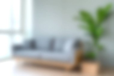 Minimalist bir kanepesi ve canlı bir iç mekan bitkisi olan şık bir oturma odası, doğal ışıkla aydınlatılmış, rahat ve çağdaş mekanlar için ideal..