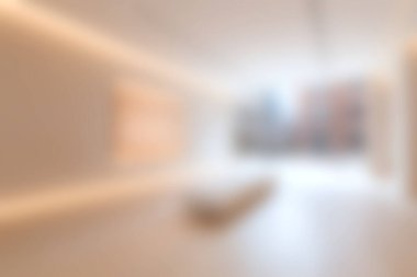 Bu resim, yumuşak ışıklandırma ve sakin bir atmosfer yaratan minimalist tasarım elementlerinin yer aldığı parlak ve davetkar bir modern iç mekan sergiliyor..