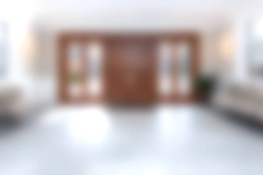 Bu görüntü, zarif ahşap kapılar ve yumuşak ışıklandırmanın yer aldığı samimi ve modern bir karşılama alanı yakalıyor. Huzurlu bir atmosfer konfor ve rahatlamaya davet eder..