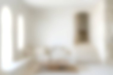 Yumuşak mobilyaların, doğal ışığın ve sakin bir ambiyansın olduğu parlak ve minimalist bir oturma odası. Modern iç tasarım ve rahatlığı sergilemek için ideal..