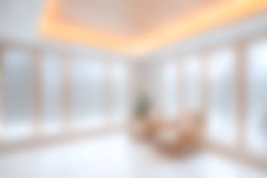 Bu görüntü, geniş pencereli ve minimalist tasarımı olan parlak ve havadar bir modern yaşam alanı yakalar. Huzurlu ortam rahatlamaya davet ediyor, doğal ışık ve şık dekorlar sergiliyor..