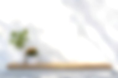 Ahşap bir masanın üzerinde bitki barındıran sakin ve minimalist bir çalışma alanı. Parlak arka plan, yaratıcılık ve üretkenlik için mükemmel taze ve sakin bir atmosferi geliştirir..