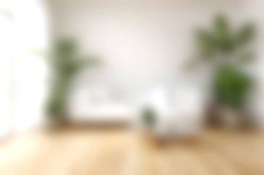 Canlı yeşil bitkilerle eşleştirilmiş minimalist beyaz mobilyaların sergilendiği parlak ve havadar bir oturma odası, dinginlik için mükemmel ve davetkar bir atmosfer yaratıyor..