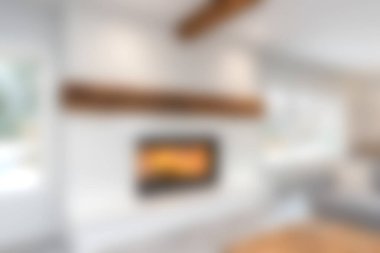 Zarif bir şöminesi olan rahat, modern bir oturma odası ev dekorasyonu ve rahatlama için ideal sıcak bir atmosfer yaratıyor. Çağdaş tasarım meraklıları için mükemmel.