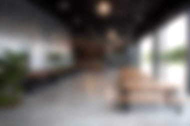 Geniş bir tasarımı, minimalist mobilyaları, doğal ışığı ve verimli bir atmosferi yaratmak için yeşilliği olan modern bir ofis..