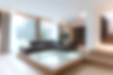 Zarif mobilyaların ve bol doğal ışığın sergilendiği, rahat ve davetkar bir ortam yaratan modern bir oturma odası..