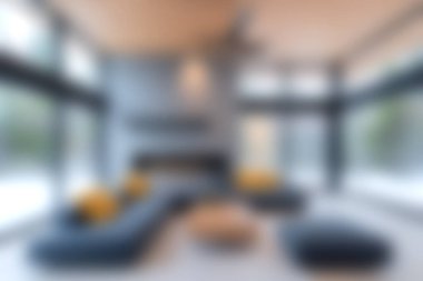 Modern bir oturma odasında geniş pencereli ve minimalist mobilyalı geniş bir tasarım sergilenerek parlak ve davetkar bir atmosfer yaratılıyor..