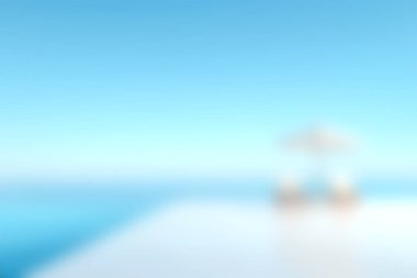 Mükemmel bir yaz gökyüzü altında berrak mavi sulara bakan beyaz bir gölgeliğin olduğu sakin bir manzara. Rahatlama ve kaçış titreşimleri iletmek için ideal.