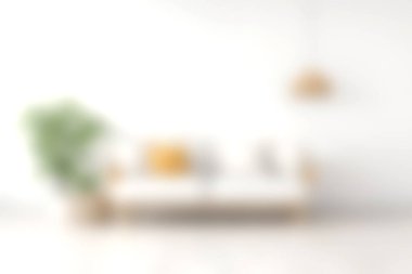 Parlak ve havadar minimalist oturma odası şık bir kanepe, kapalı bir bitki ve sıcak bir ışık sergiliyor. Rahatlamak için mükemmel bir ortam yaratıyor..