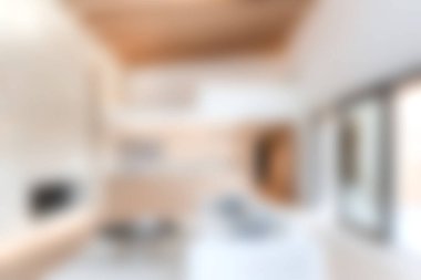 Bu resim modern minimalist bir iç mekan ve parlak doğal ışıklandırmayı sergiliyor, şık bir yaşam alanını vurguluyor. Tasarım ilhamı veya dekor temaları için ideal.