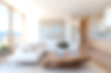 Modern dekorun yer aldığı parlak ve rahat bir oturma odası geniş doğal ışık pencereleri ve rahatlama ve toplanma için mükemmel sıcak bir atmosfer..