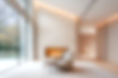 Bu resim, yumuşak doğal ışıkla yıkanmış zarif mobilyaların yer aldığı modern ve rahat bir oturma odasını gösteriyor. Minimalist iç tasarım temaları için ideal.