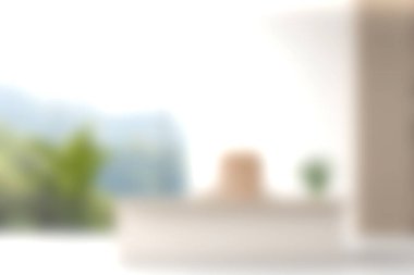 Bu resim, doğal ışıkla dolu çağdaş bir yaşam alanını gösteriyor. Minimalist tasarım elementleri ve dingin ambiyansı geliştirmek için canlı yeşillik içeriyor..