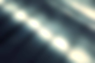 Bu soyut resim, karanlık bir yüzeyde büyüleyici bir gölge ve ışık etkileşimi sergiliyor ve benzersiz görsel desenler ve dokular yaratıyor..