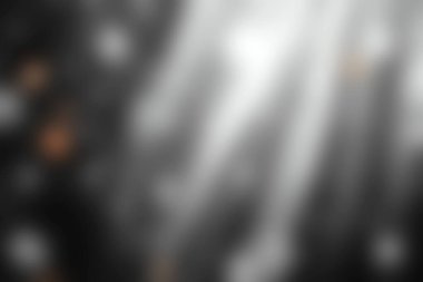 Yumuşak ışıklar ve çeşitli tasarım projeleri için mükemmel siyah beyaz tonlarda hafif kar yağışı efektleri içeren büyüleyici soyut bir arka plan..