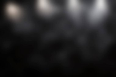 Etkileyici soyut bir arka plan, çarpıcı ışıklandırmayla aydınlatılmış koyu dokulu bir yüzey. Çeşitli yaratıcı projeler ve fotoğrafçılık için ideal.