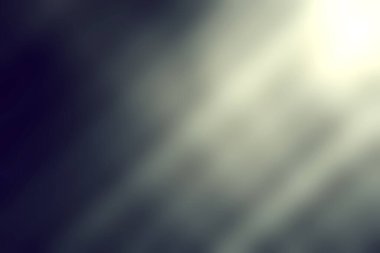 Bu soyut görüntü karanlık bir arkaplanda ışık ışınlarını yakalar, toz parçacıklarıyla dolu büyüleyici bir sahne yaratır, çeşitli tasarım uygulamaları için modern bir estetik ideal sunar.