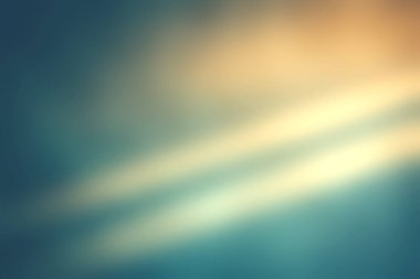 Bu soyut görüntü, mavi ve altının zengin tonlarının yer aldığı grunge arka planda yumuşak ışık gölgeleri sergiliyor. Sanatsal projeler için ideal.