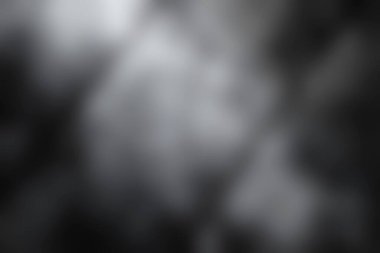 Karmaşık dokuları olan siyah ve gri metalik bir yüzey içeren çarpıcı bir soyut arkaplan araştırın. Çeşitli tasarım projeleri için ideal.