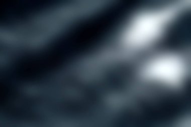 Bu resim, yaratıcı projeler, arka planlar veya sanatsal uygulamalar için ideal dalgalı çizgilerin akış modeline sahip koyu dokulu bir materyali içerir..