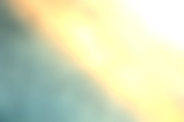 Yumuşak ışık ve mavi ve altının dokulu renklerinden oluşan sakin ve soyut bir arka plan, yaratıcı projeler ve rahatlatıcı görseller için mükemmel..