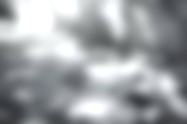 Bu görüntü yumuşak gölgeleri dokulu bir yüzeyde yakalar, aydınlık ve karanlık karmaşık desenler yaratır, basitlikte bir sükunet ve güzellik hissi uyandırır..