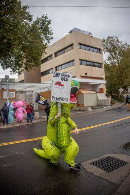 PORTLAND, OR - OCTOBER 11:  The City of Portland protests, some in inflatable costumes in the rain outside the U.S. Immigration detention facility, with unanimous support from the Governor, Mayor, and City Council over the planned federal deployment.