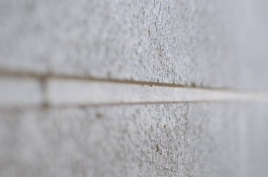 Beyaz beton duvarın makro fotoğrafı