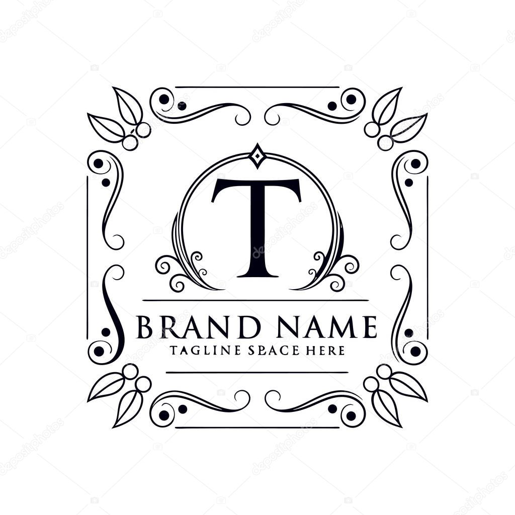 Luxury monogram letter T logo with floral frame and elegant ornament design