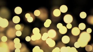 4K döngüsü Soyut Hareket arka planı parlayan altın parçacıkları. Parıldayan Parçacıklar Bokeh ile.