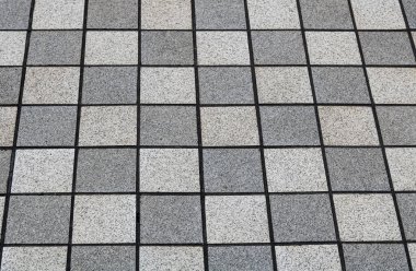 Klasik bir dama tahtası düzeninde dikey yerleştirilmiş kare karoların geometrik deseni.