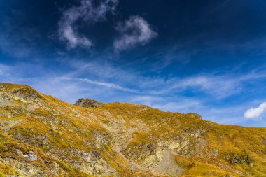 The breathtaking Capra Lake, nestled in the majestic Fagaras Mountains of Romania. A stunning summer landscape