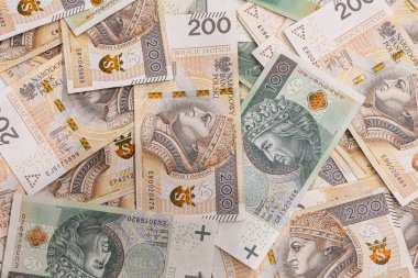 100 ve 200 zloti 'lik banknotlarla Polonya parasının tam çerçeve görüntüsü ekonomik temalar için zengin bir mali geçmiş yaratıyor.