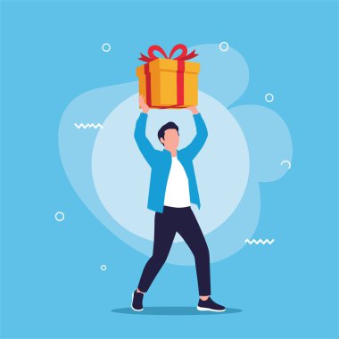 Güçlü bir adam, kafasında parlak kırmızı bir kurdele olan büyük sarı bir hediye kutusunu mavi dekoratif soyut arka planda tutuyor..