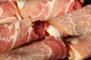 Wrapped raw smoked ham slices for appetizer