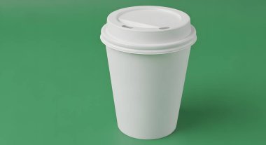 A plain white disposable coffee cup with a lid, isolated on a solid green background.