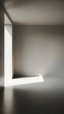 Camdan yansıyan doğal ışık huzmeleriyle aydınlatılmış sakin boş bir oda..