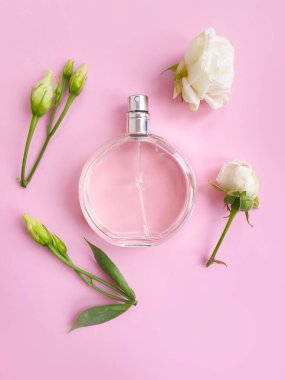 bottle perfume flower on a colored background clipart
