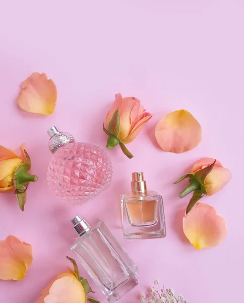 bottle perfume flower on a colored background